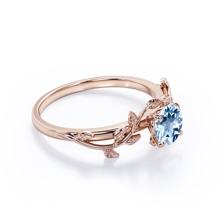 Sky Blue Topaz Leaf Solitaire in Rose Gold