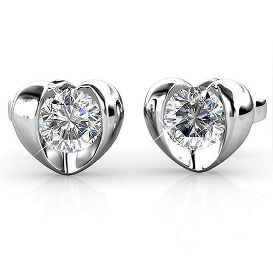 Heart Stud EarringsThis Heart Shaped earring features a round-cut crystal made with Crystals from Swarovski. These earrings are made in high quality brass with Rhodium plating.
FeatureEarringsDhia JewelleryDhia JewelleryHeart Stud Earrings